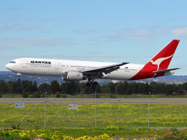 BOEING 767-300 (VH-ZXC) - About to put down on runway 05. Thursday 12th July 2012.
