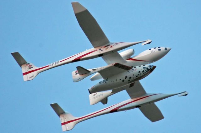 N318SL — - Scaled Composites White Knight N318SL and SpaceShipOne N328KF take off from Runway 30 at Mojave just before sunrise at 6:48 A.M. on October 4, 2004 to win the Ansari X-prize for the first two flights above 100 kilometers.