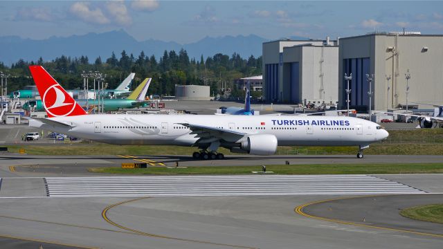 BOEING 777-300 (TC-JJT) - THY6900 taxis from the Boeing ramp for delivery to LTBA / IST on 9/4/14. (LN:1233 / cn 44118).