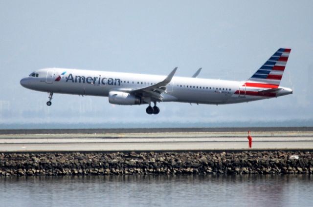 Airbus A321 (N124AA) - Morning arrival, AA # 2207 from DFW, Landing 28L  08-23-2015