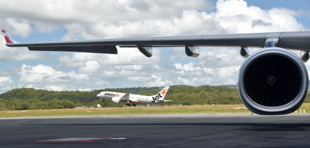 Boeing 787-8 (VH-VKJ) - Jetstar 11 rotates out of Gold Coast Airport under the wing of AirAsias XAX206 (9M-XBA A333)