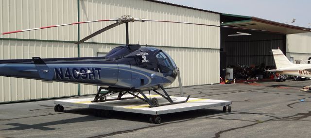 Enstrom 280 Shark (N409HT) - LINDEN AIRPORT-LINDEN, NEW JERSEY, USA-JUNE 20, 2023: Seen by RF in front of its hangar was this Enstrom 280FX helicopter. The first  br /   picture of N409HT.