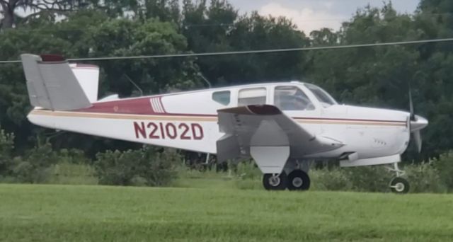 Beechcraft 35 Bonanza (N2102D) - Standing at the FBO as this airplane landed. Aug 18, 2019