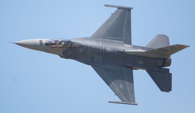 01050 — - Garret "Toro" Schmitz is showing off his F-16 to the crowd attending the 2019 Thunder Over Michigan airshow.