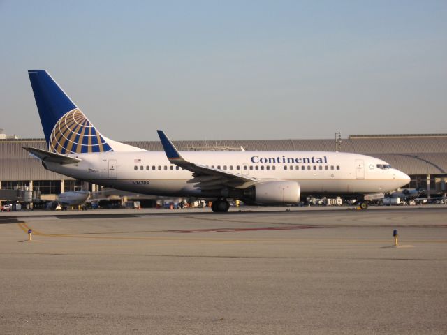 Boeing 737-700 (N16709) - Holding on RWY 19R