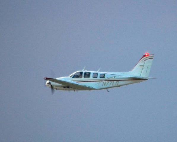 Beechcraft Baron (58) (N77LB) - Departing EAA Airventure/Oshkosh on 24 July 2012
