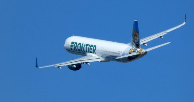 Airbus A321 (N712FR) - Shortly after dpearture is this 2016 Frontier Airlines Airbus A321-211 with "Spot" the Jaguar looking back in the Spring of 2021.