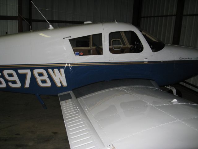 Piper Cherokee (N6978W) - N6978W tucked away in her hangar.