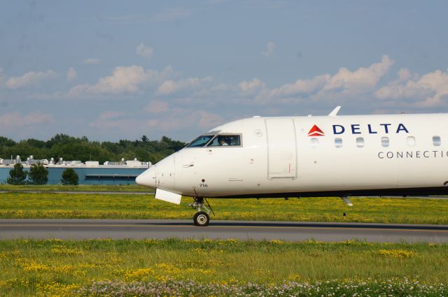 Canadair Regional Jet CRJ-700 (N716EV) - An ExpressJet CRJ-700 taxis for runway 19 at Albany, NY for a departure to Detroit, Michigan. 