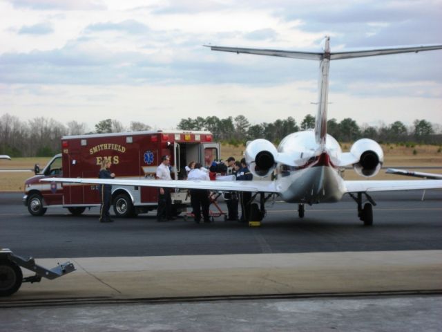 Mitsubishi MU-300 Diamond (N110DS) - Airborne Critical Care, LLCs MU-300 aircraft AKA Critical Care One. Loading a critical patient prior to takeoff.