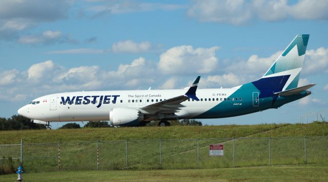 Boeing 737 MAX 8 (C-FEWJ) - 10/15/22 taxiing in on Juliet