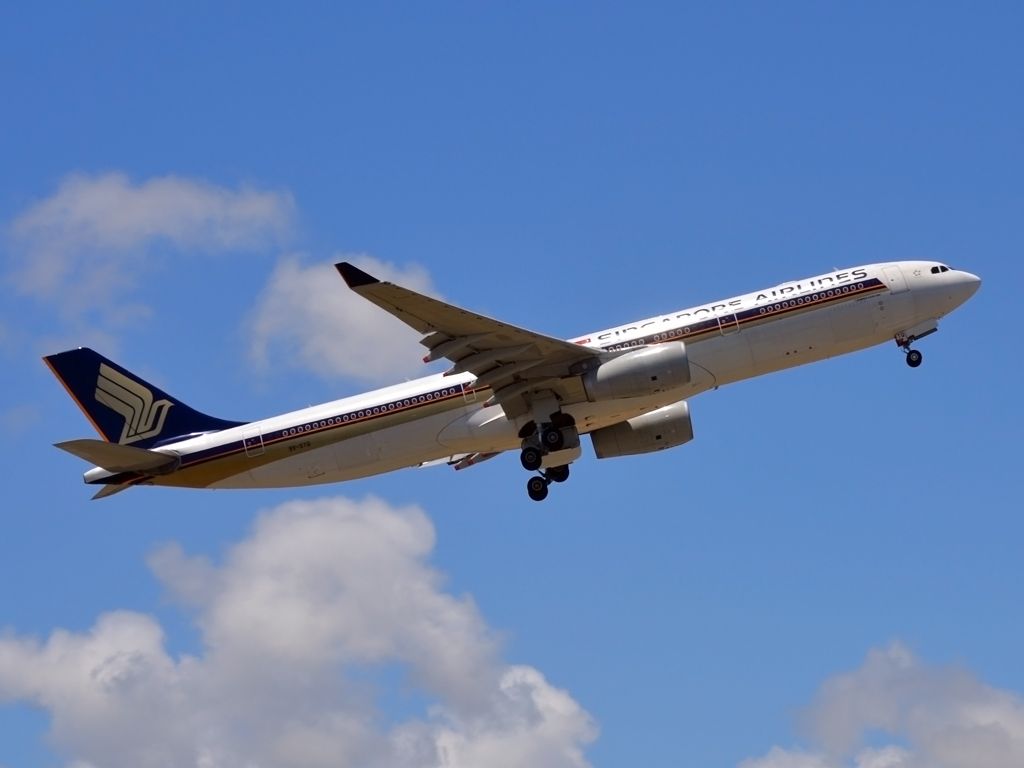 Airbus A330-300 (9V-STQ) - Getting airborne off runway 23 and heading home to Singapore. Monday 19th Dec. 2011