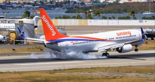 Boeing 737-700 (C-GNVR) - Sunwing airlines landing at TNCM St Maarten on 28/03/2019