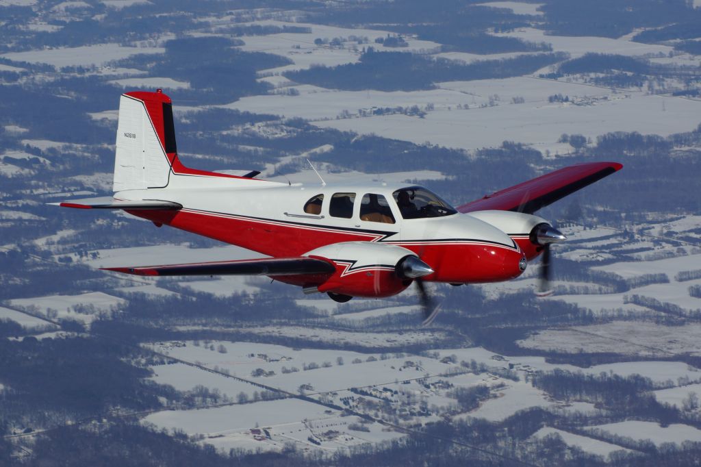 Beechcraft Twin Bonanza (N261B) - Over Northern Indiana. 