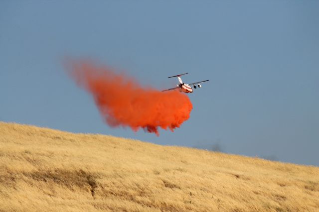 British Aerospace BAe-146-300 — - A BAe 146 lays fire retardant over the head of the Loma fire which reached over 500 acres.