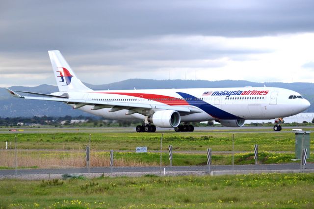 Airbus A330-300 (9M-MTC) - On taxi-way heading for take off on runway 05, for flight home to Kuala Lumpur, just before the arrival of a rain storm. Thursday 12th July 2012.