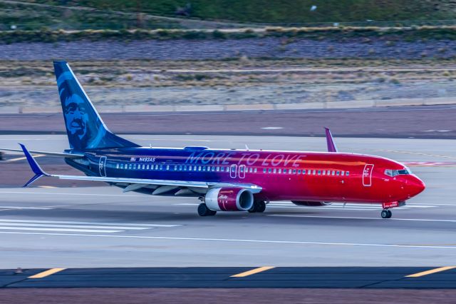 Boeing 737-900 (N493AS) - An Alaska Airlines 737-900 in More to Love special livery taking off from PHX on 2/28/23. Taken with a Canon R7 and Canon EF 100-400 L ii lens.