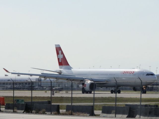 Airbus A330-300 (HB-JHF) - Peace and good will to all.In any language!