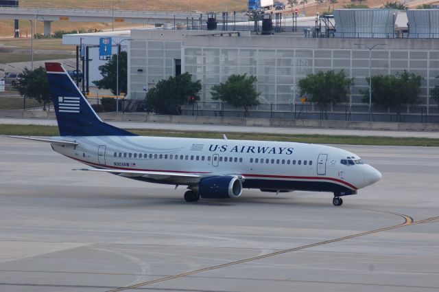 BOEING 737-400 (N303AW) - Taxiing on RC at IAH.