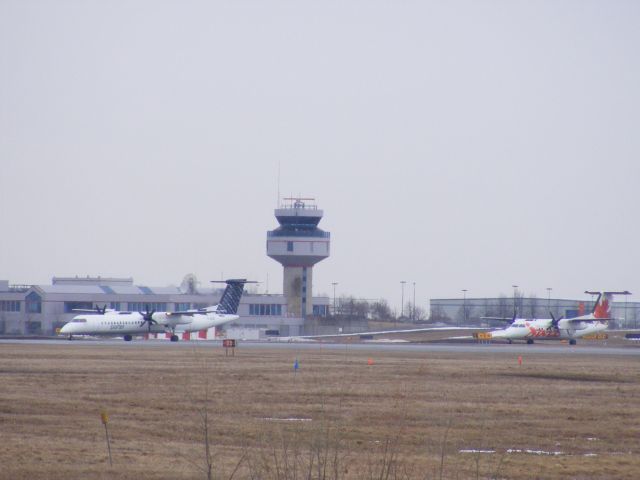 — — - 2 different types of dash 8s from 2 different airlines.
