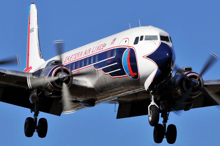 N836D — - The Historical Flight Foundations restored Eastern Air Lines DC-7B on short final approach to Opa-locka Executive Airport on Saturday, January 15, 2011.   They were returning to home base after flying a plane load of aviation enthusiasts on a 45-minute trip up the coast to Palm Beach and then down to Key Biscayne at low altitude off the beach.