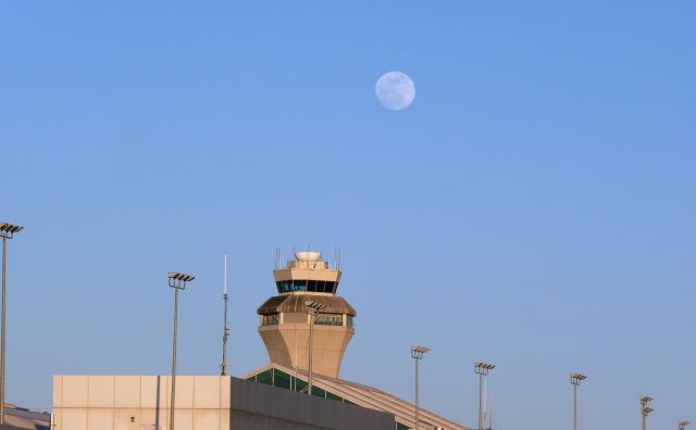 — — - PDX tower and the moon.