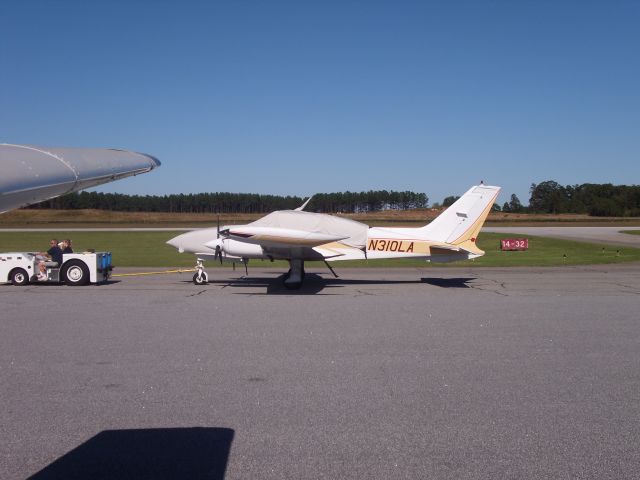 Cessna 310 (N310LA) - Moving from one side of the field to the other