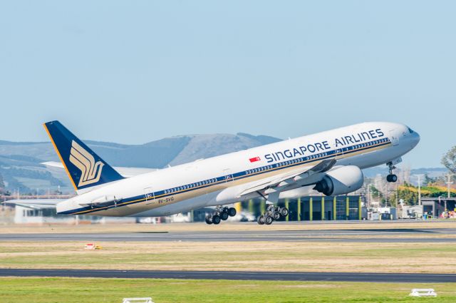 Boeing 777-200 (9V-SVG) - Singapore Airlines Flight 298 rotating on Runway 20 at Christchurch International Airport, bound for Singapore on a lovely sunny winters morning on Monday 25 July 2016. Looking south to the Airport Rescue Service base.