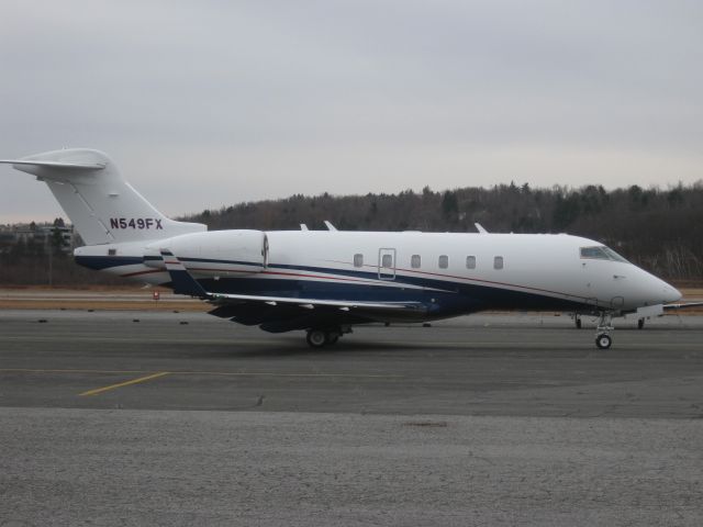 Bombardier Challenger 300 (N549FX) - Taxiing out to depart runway 14.