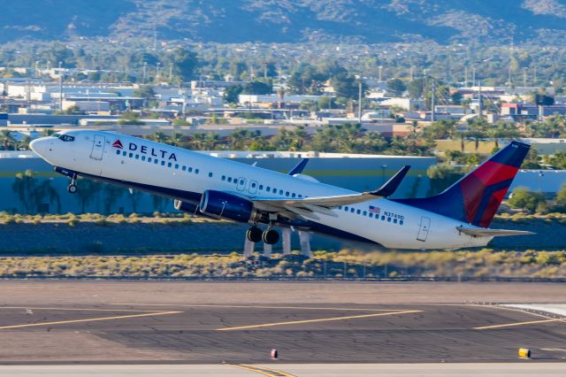 Boeing 737-800 (N3749D) - Delta Airlines 737-800 taking off from PHX on 11/11/22. Taken with a Canon R7 and Tamron 70-200 G2 lens.