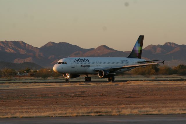 Airbus A319 (N505VL) - take off on runway 23 to mexico airport