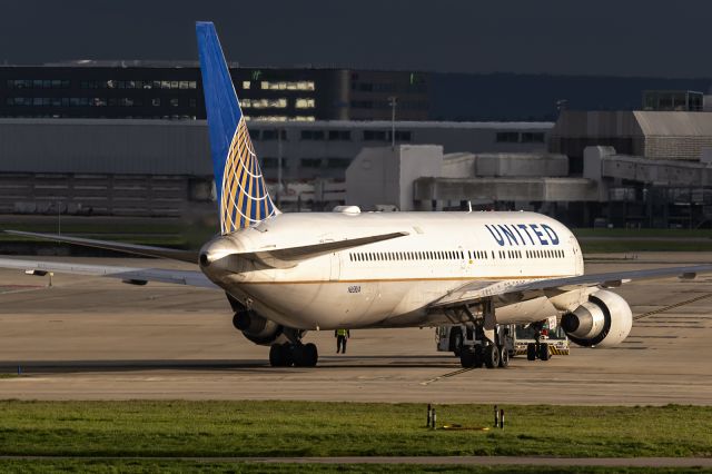 BOEING 767-300 (N658UA) - 26th March, 2023: Streak of sunlight through London's grey clouds catches United's flight UA 921 headed to Newark just as she completes her push-back from the Star Alliance terminal 2 at Heathrow. 