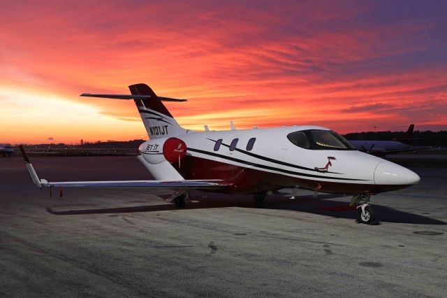 Honda HondaJet (N101JT) - How’s this for a colorful sunrise behind this HondaJet Elite? It was only out long enough for this shot then the clouds drifted in. I caught N101JT, operated by Jet It, this morning, (24 Oct 2021.