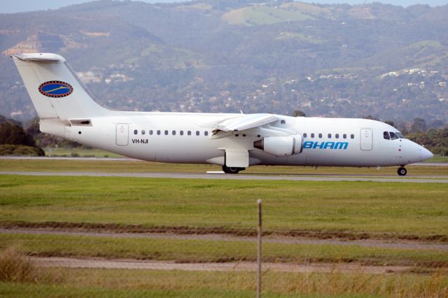 Avro RJ-100 Avroliner (VH-NJI) - On taxiway heading for take-off on runway 05. Thursday, 19 June 2014.