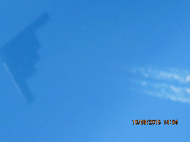 Northrop Spirit (82-1070) - Very high over Baxter Springs Kansas. When I first seen it was heading straight west and made a left hand turn heading south southeast.