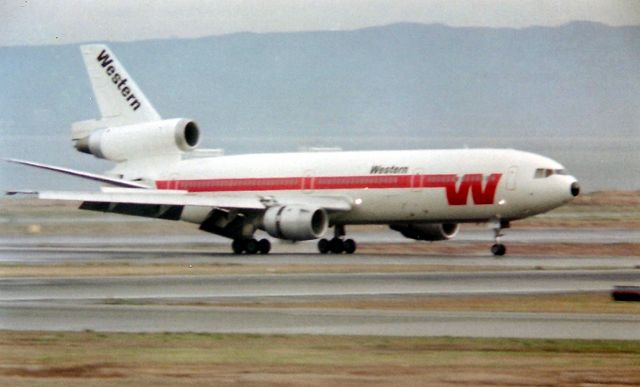 McDonnell Douglas DC-10 (N9XXWA) - KSFO- Western DC-10 arriving 19R at SFO in the late 1970's. Not my best photo but my only full SFO shot, and kinda blurry. Taken from the old OBS deck at SFO- Minolta SRT-102 1000mm Celestron C-90 100 ASA.