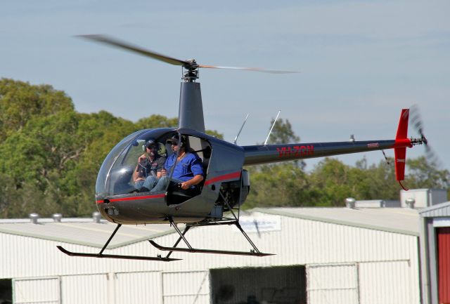 Robinson R-22 (VH-ZGN) - Taxiing out to 07 for training flight - facial expressions interesting