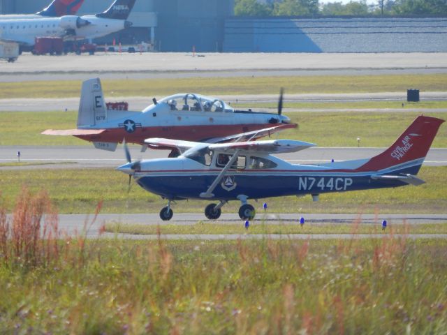 Cessna Skylane (N744CP) - CAP Cessna 182 with a Navy trainer Beechcraft T-6 Texan II in the background