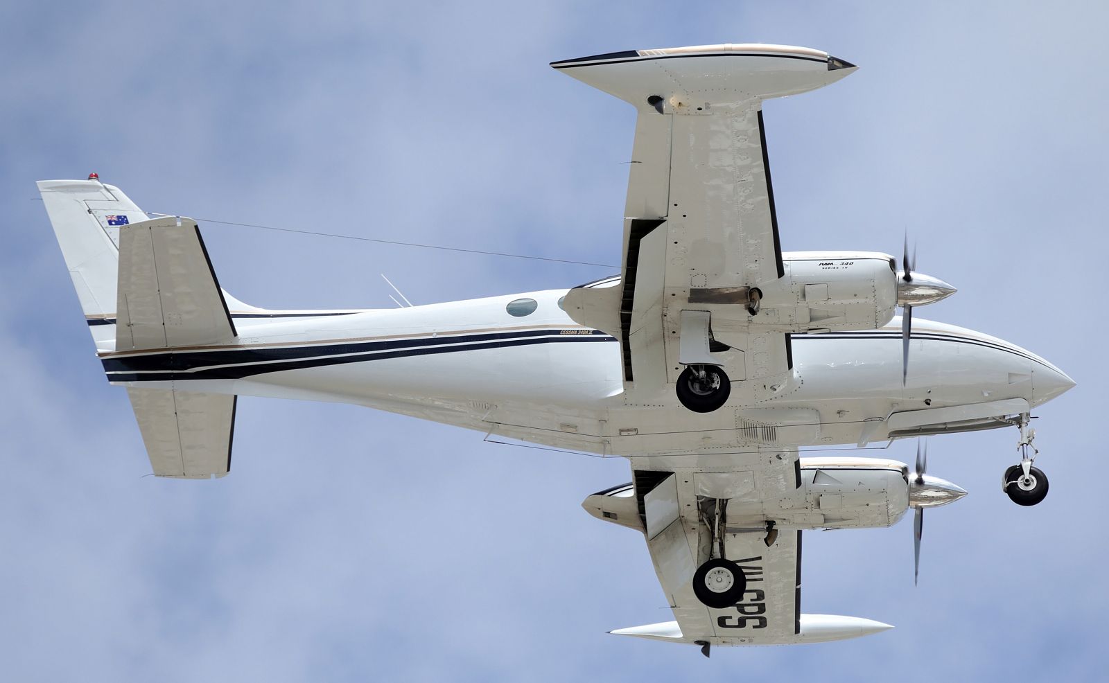 — — - A Twin Cessna, on short finals for runway 01 at YBTL.