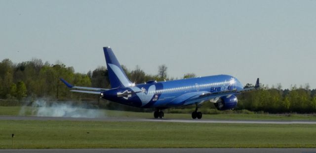 Airbus A220-300 (N211BZ) - Touching down is this 2011 Breeze Airways Airbus 220-300 in the Spring of 2025.  KIAD -KOGS