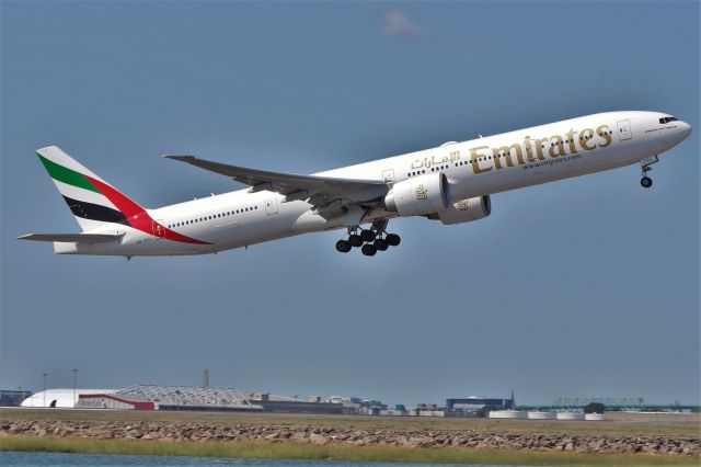 BOEING 777-300 (A6-ECL) - Emirates 777-300ER (EK240) departing off of 4R this morning.