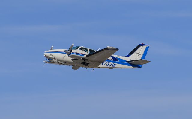 Beechcraft 55 Baron (N73JW) - Runway 23 departure @KUGN.