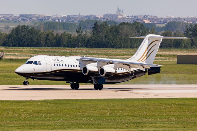 Avro RJ-100 Avroliner (C-GSUI) - Avro RJ touching down on runway 25.