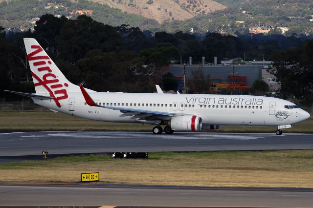 Boeing 737-800 (VH-YIE) - TAKEN THRU THE GLASS OF THE DEPARTURES LOUNGE ON 3 MAY 2017