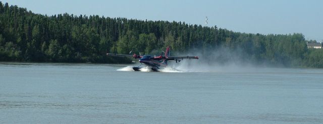 De Havilland Canada Twin Otter (C-FWAH) - Take-off on the Burntwood River in Thompson, Manitoba.  Pilot James Stewart.  Photo by Teresa Stewart