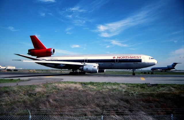 McDonnell Douglas DC-10 (N147US) - KSFO - DC-10-40 set for departure slowly idling by as aircraft take off on the 1R departure runway. click full.