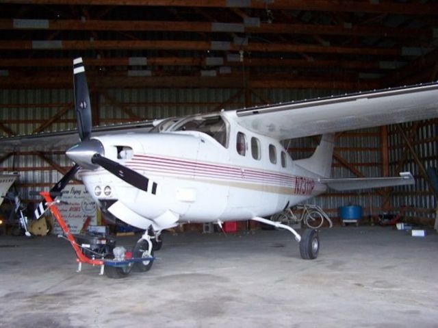 Cessna P210 Pressurized Centurion (N7311P) - My father had just bought this plane, and died shortly after. The plane meant so much to him, my mother had a special headstone made for him with the plane (including tail number) on it. Now both my parents are buried with this P210 flying them where ever they desire.