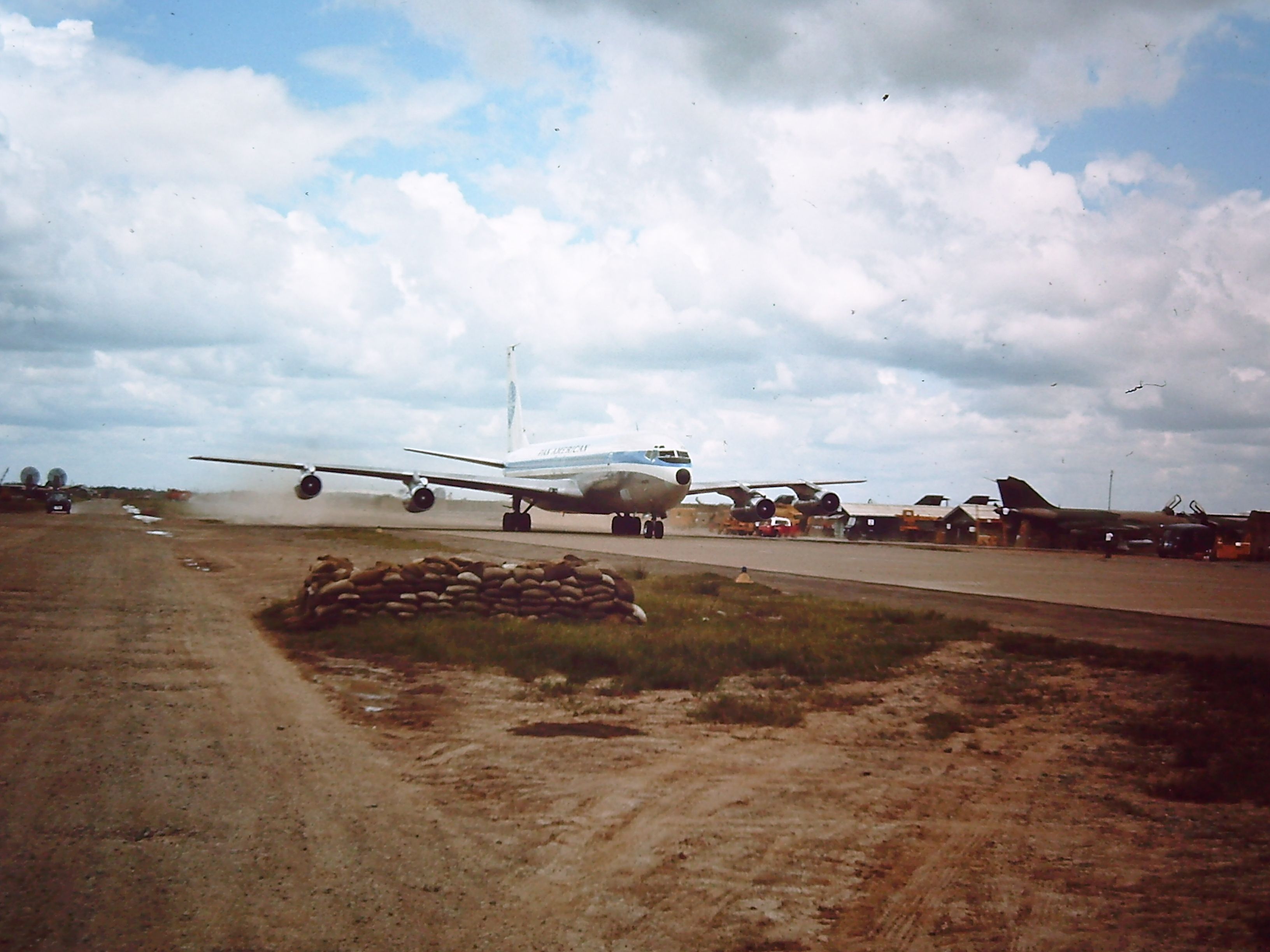 Boeing 707-100 — - TAN SON NHUT AIR BASE, SAIGON, VIETNAM 1966 PAN AM Boeing 707 taxing to the ramp