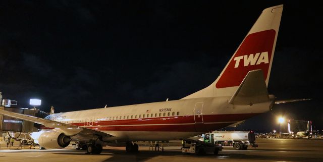 Boeing 737-800 (N915NN) - This one has been captured by many photogs and posted into FAs gallery a bunch of times since American repainted it to show the old TWA livery, so I figured I would add my shot to the collection.br /N915NN makes its first visit to Reno since being redressed into TWA attire, and it is shown here in a 5:30 AM shot as it is being prepped for an early morning trip to Dallas (DFW).