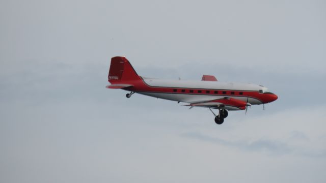 Douglas DC-3 (turbine) (N115U) - rather grainy on finals to KOSH quick snap shot from my back yard..